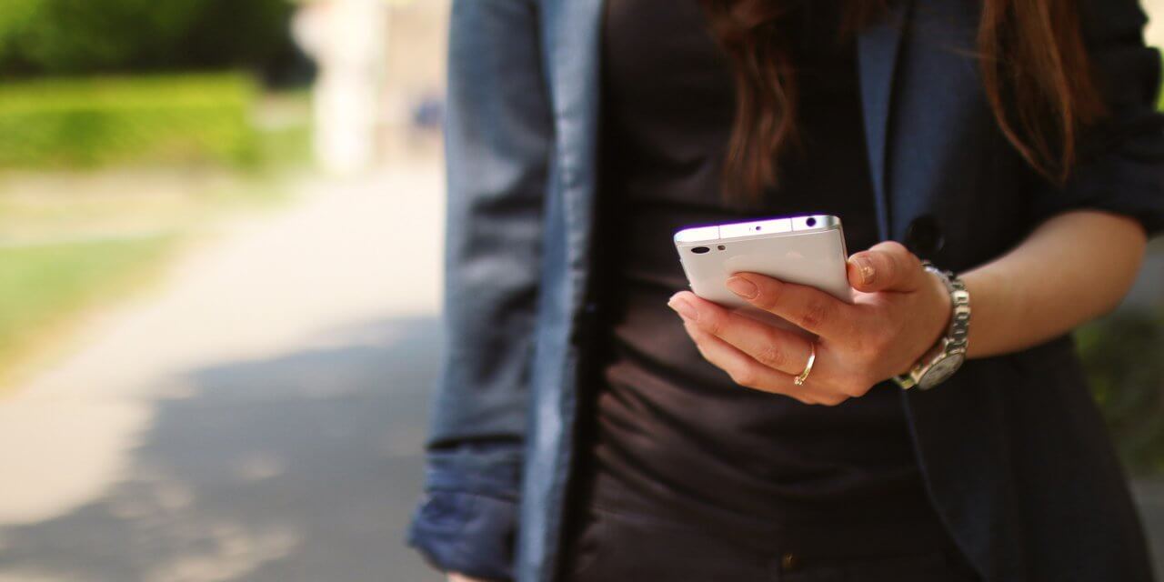 A woman uses her smartphone