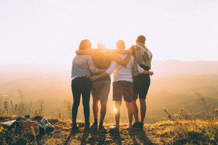 A group of people admiring the sunset