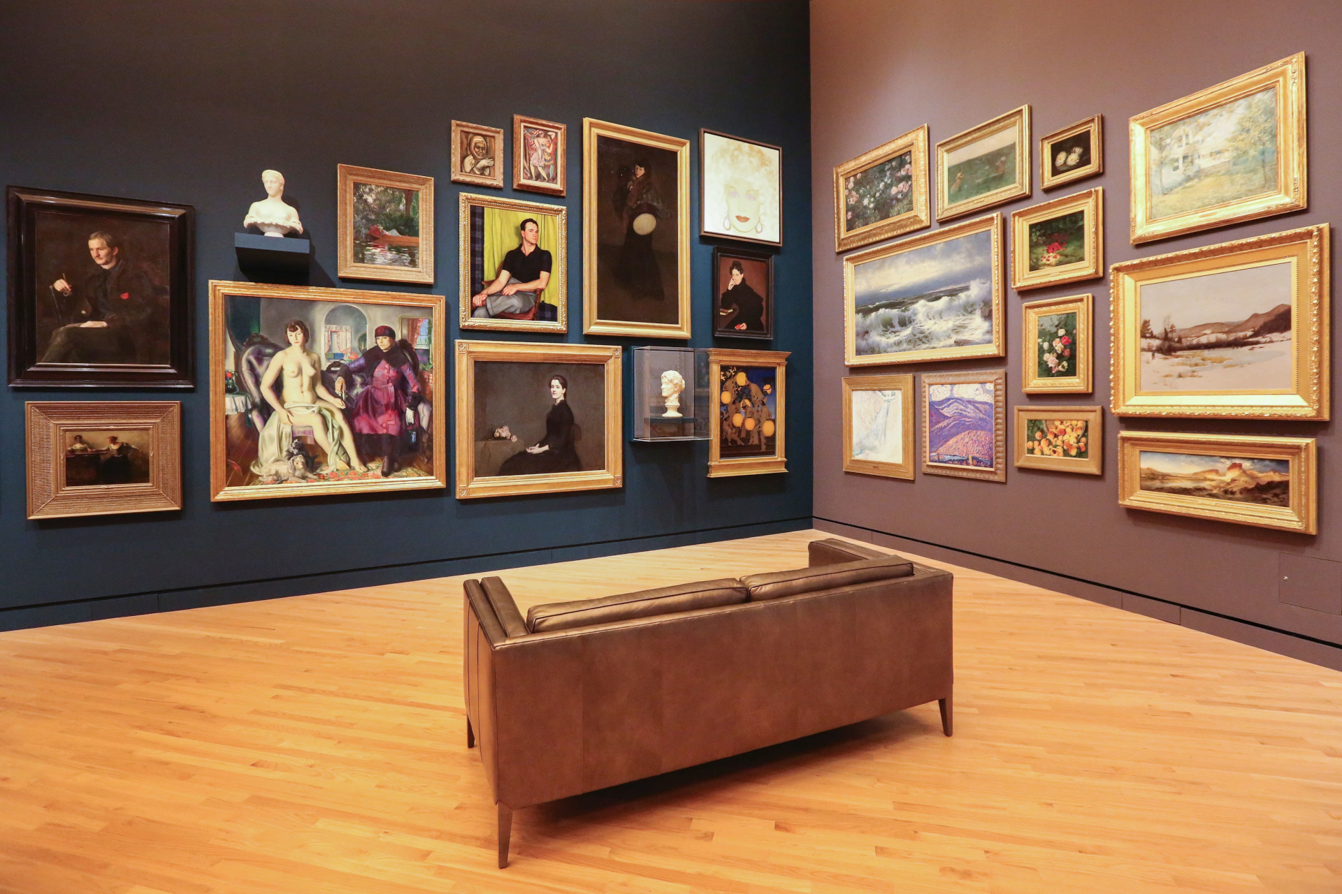 Display of several paintings in a museum