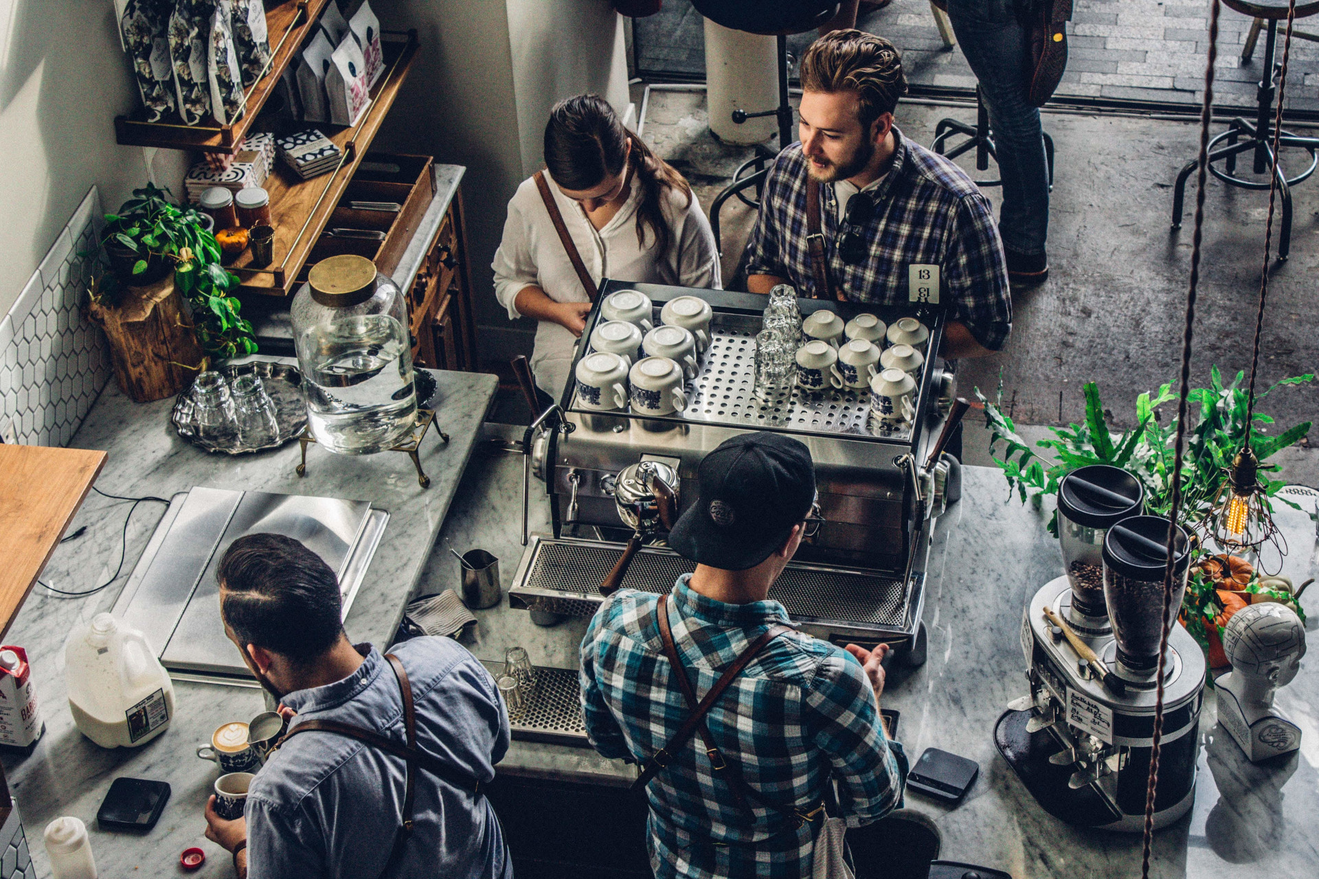 A coffee shop with staff serving customers