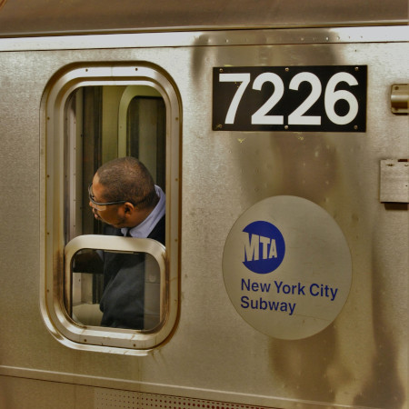 An agent of the MTA on a train