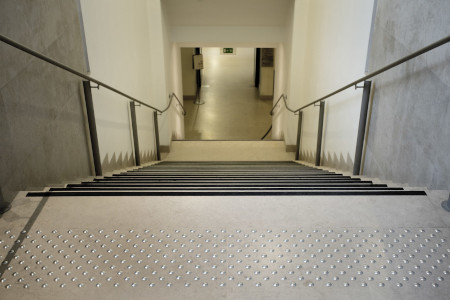 Accessible stairs for the visually impaired with detectable warning surfaces, handrails and contrasting non-slip stair nosing