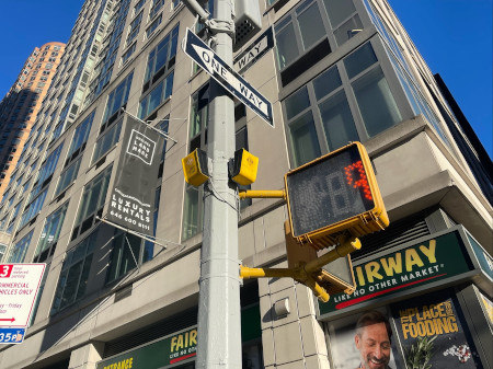 The accessible pedestrian aBeacon fixed at pole in New York City uses a guiding sound corridor