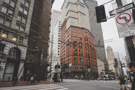 Pedestrians waiting to cross at an intersection in San Francisco