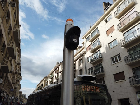 An audio beacon set up at a pole after the removal of traffic lights in Rouen, France