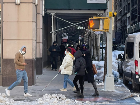 A blind pedestrian reached the other side of the crossing after actuating the accessible pedestrian signals