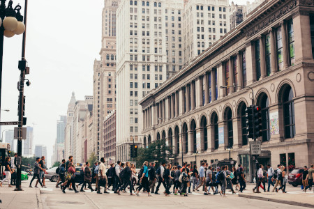 A lot of pedestrians crossing the street in Chicago