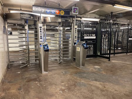 The entrance of the JaySt-MetroTech subway station in New York City with turnstiles