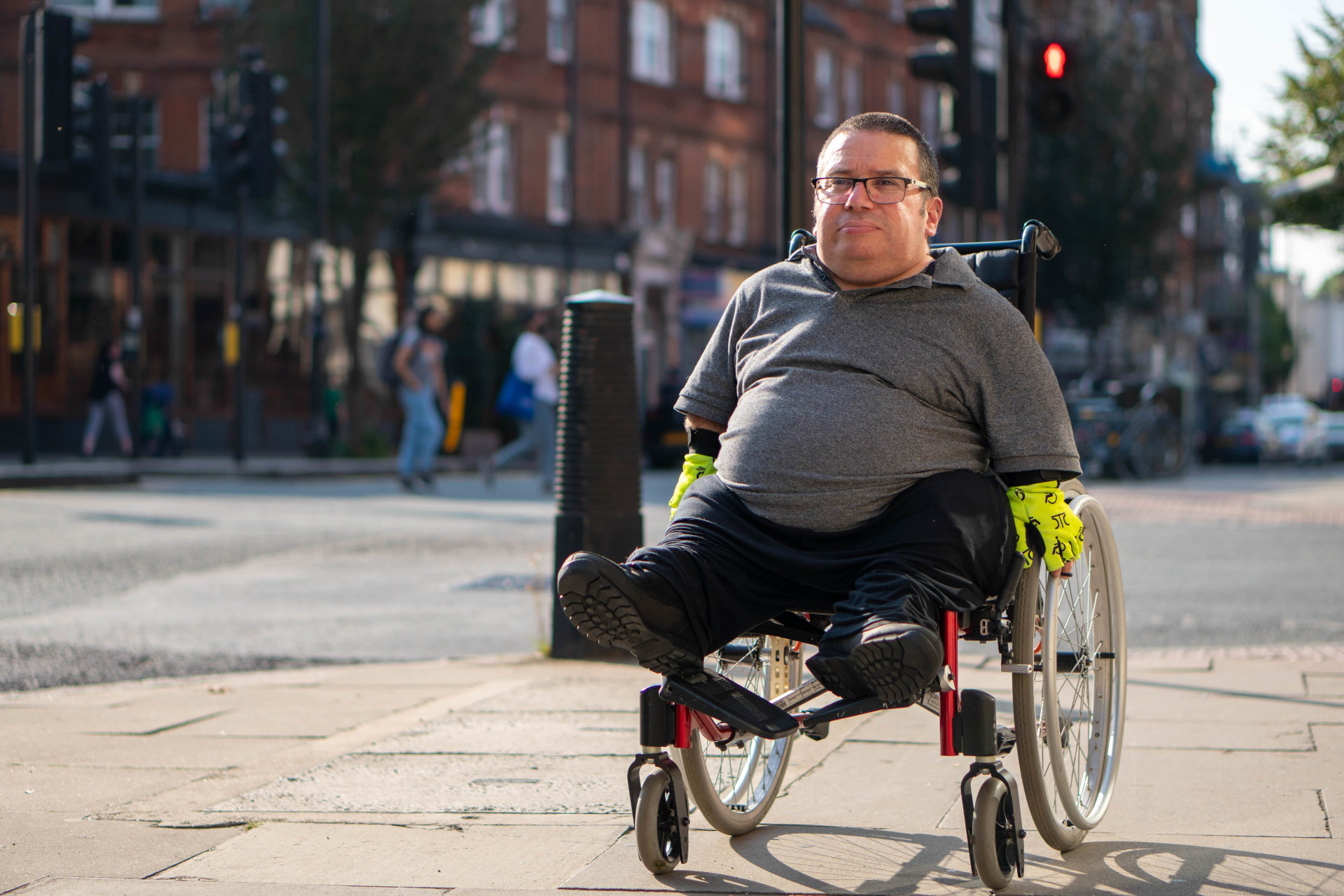 A man in a wheelchair in the streets
