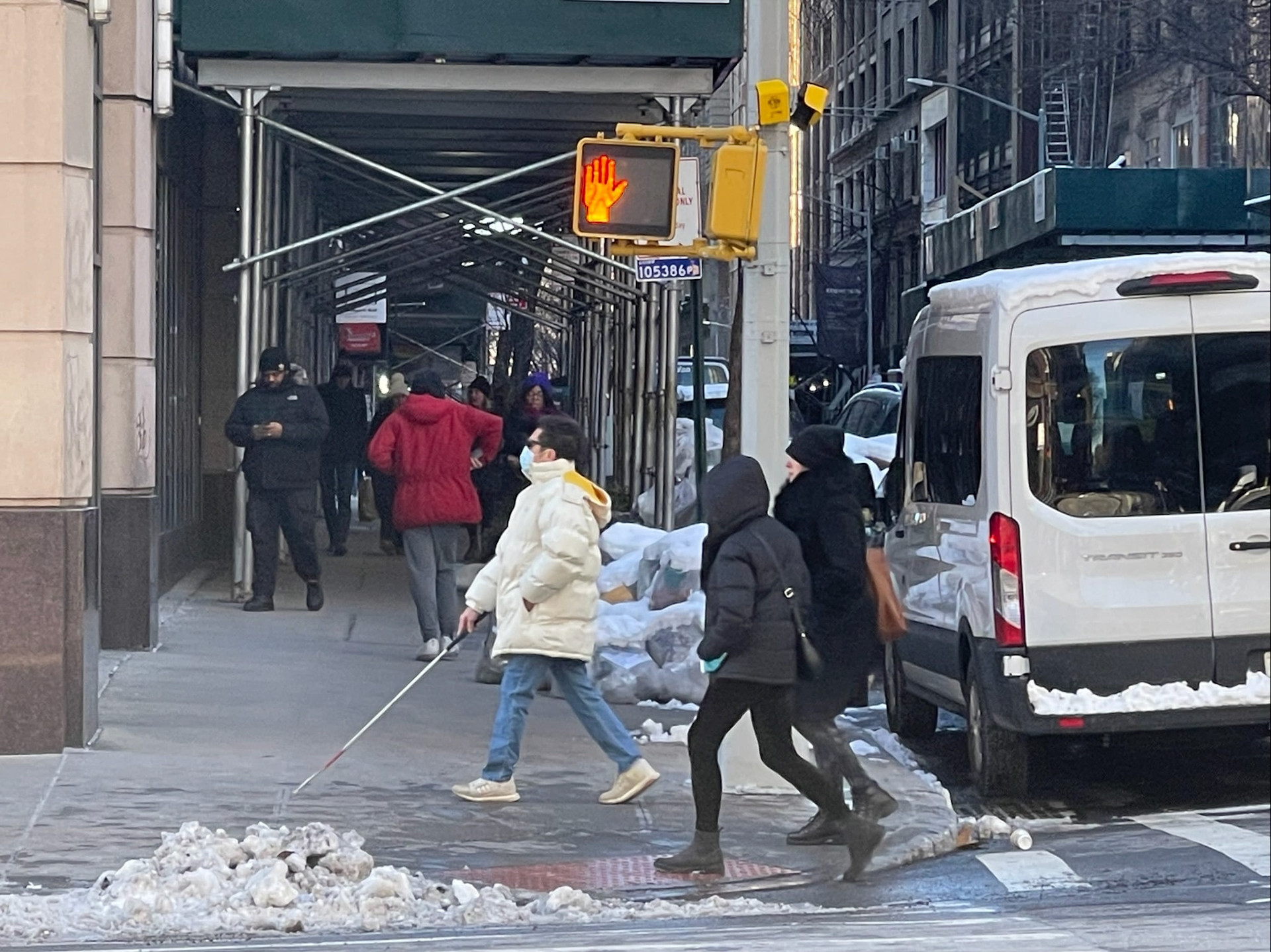 A blind man crossed the street after activating the APS aBeacon with a remote control