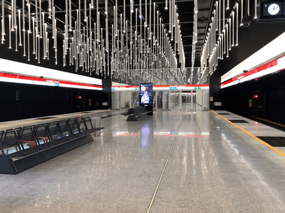 The inside of the Kivenlahti subway station with audio beacons outside and inside the platform door announcing the direction of the subway line and Glowway light emitting yellow tactile path guiding the right place of the train accessible door.