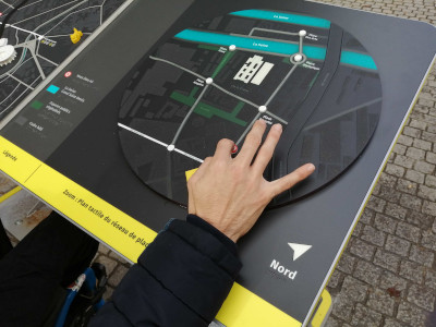 A wheelchair user is testing the multisensory maps